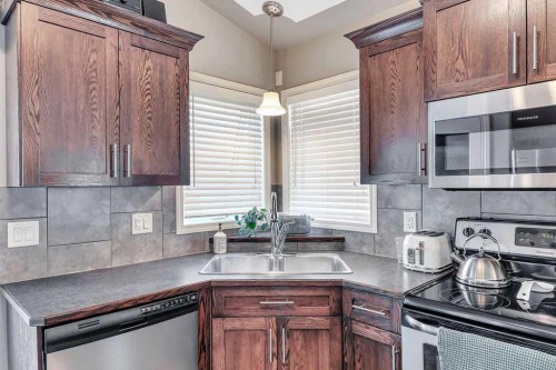 212 Cedar Square, Blackfalds, AB - Indoor Photo Showing Kitchen With Double Sink