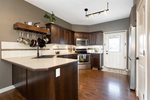 19 Hanson Green, Penhold, AB - Indoor Photo Showing Kitchen With Double Sink
