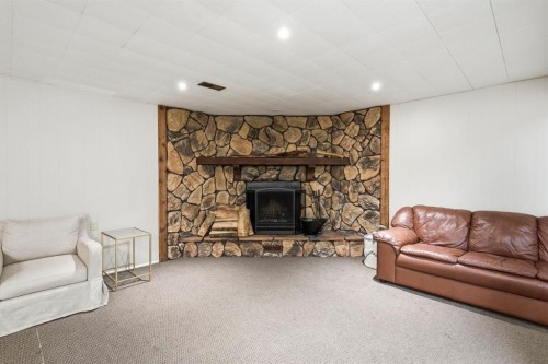 67 Sherwood Crescent, Red Deer, AB - Indoor Photo Showing Living Room With Fireplace