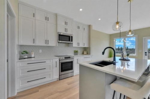 153 Norseman Close, Penhold, AB - Indoor Photo Showing Kitchen With Double Sink With Upgraded Kitchen