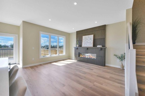 153 Norseman Close, Penhold, AB - Indoor Photo Showing Living Room With Fireplace