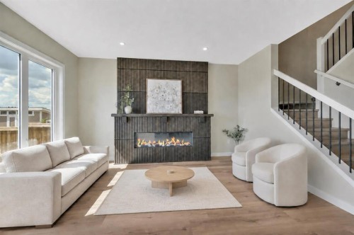 153 Norseman Close, Penhold, AB - Indoor Photo Showing Living Room With Fireplace