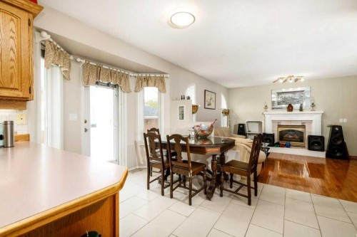 92 Anquetel Street, Red Deer, AB - Indoor Photo Showing Dining Room With Fireplace