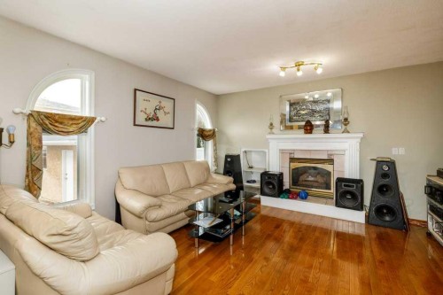 92 Anquetel Street, Red Deer, AB - Indoor Photo Showing Living Room With Fireplace