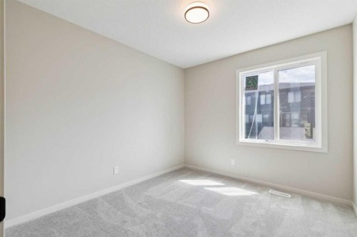 78 Bluerock Hill Sw, Calgary, AB - Indoor Photo Showing Other Room