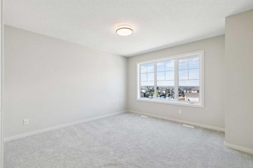 78 Bluerock Hill Sw, Calgary, AB - Indoor Photo Showing Other Room