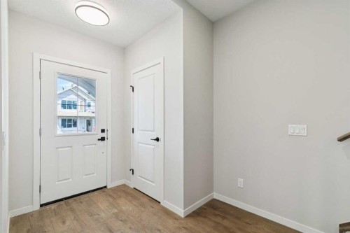 78 Bluerock Hill Sw, Calgary, AB - Indoor Photo Showing Other Room