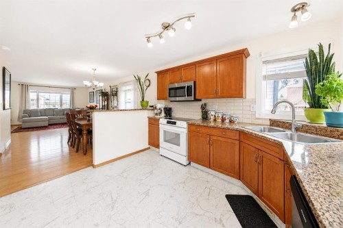 138 Lanterman Close, Red Deer, AB - Indoor Photo Showing Kitchen With Double Sink