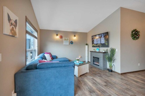 148 Oswald Close, Red Deer, AB - Indoor Photo Showing Living Room With Fireplace