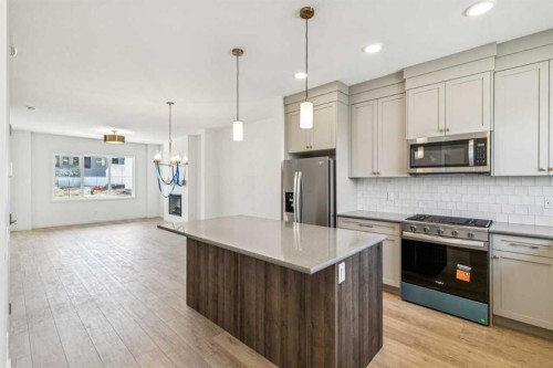37 Bluerock Hill Sw, Calgary, AB - Indoor Photo Showing Kitchen With Upgraded Kitchen