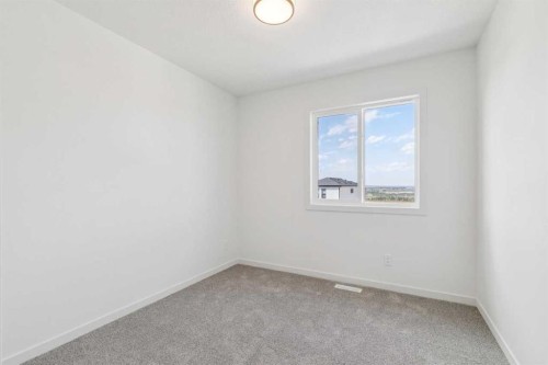 37 Bluerock Hill Sw, Calgary, AB - Indoor Photo Showing Other Room