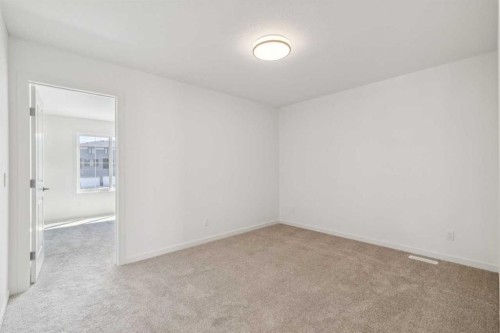 37 Bluerock Hill Sw, Calgary, AB - Indoor Photo Showing Other Room