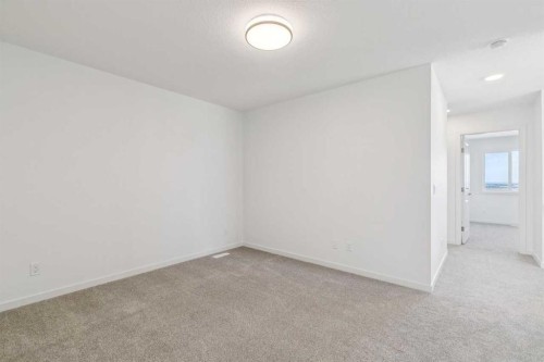 37 Bluerock Hill Sw, Calgary, AB - Indoor Photo Showing Other Room