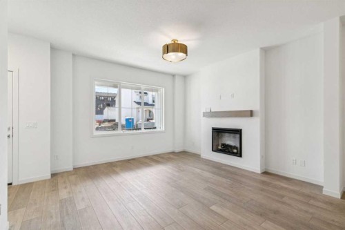 37 Bluerock Hill Sw, Calgary, AB - Indoor Photo Showing Living Room With Fireplace