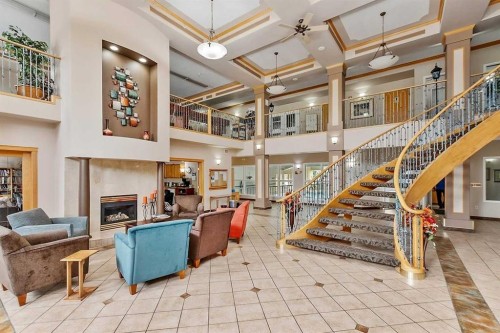 412-4512 52 Avenue, Red Deer, AB - Indoor Photo Showing Other Room With Fireplace