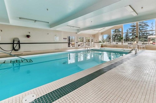 412-4512 52 Avenue, Red Deer, AB - Indoor Photo Showing Other Room With In Ground Pool