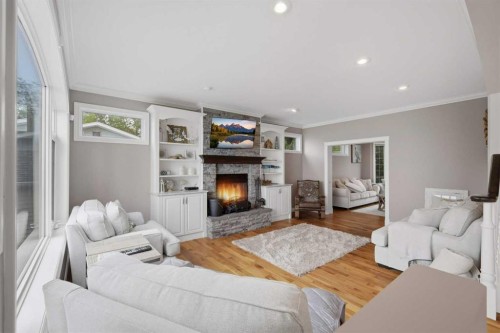 85 Grand Ave, Norglenwold, AB - Indoor Photo Showing Living Room With Fireplace