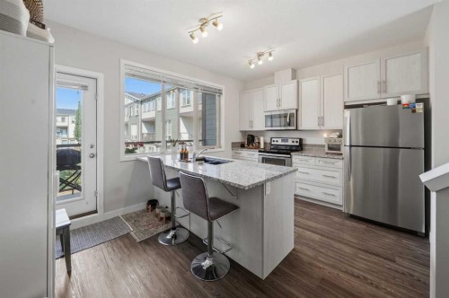 604-125 Caribou Crescent, Red Deer, AB - Indoor Photo Showing Kitchen With Stainless Steel Kitchen With Double Sink
