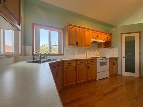 114 Sunridge Avenue, Blackfalds, AB - Indoor Photo Showing Kitchen With Double Sink