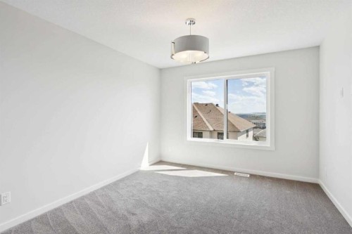 386 Heritage Boulevard, Cochrane, AB - Indoor Photo Showing Other Room