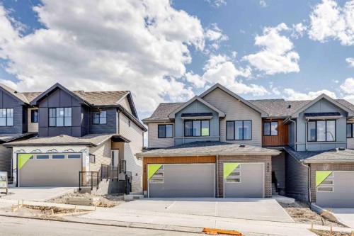 386 Heritage Boulevard, Cochrane, AB - Outdoor With Facade