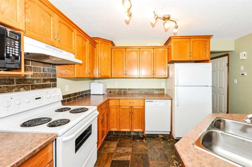 4009 69A Street Close, Camrose, AB - Indoor Photo Showing Kitchen With Double Sink
