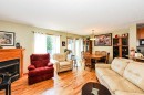 4009 69A Street Close, Camrose, AB  - Indoor Photo Showing Living Room With Fireplace 