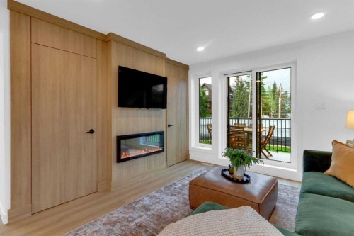 523-608 7 Avenue, Canmore, AB - Indoor Photo Showing Living Room With Fireplace