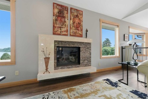 37 Wildrose Street, Rural Lacombe County, AB - Indoor Photo Showing Living Room With Fireplace