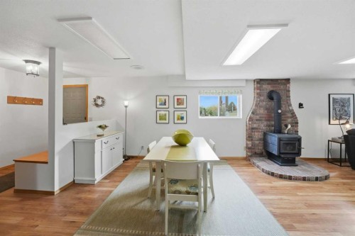 37 Wildrose Street, Rural Lacombe County, AB - Indoor Photo Showing Dining Room With Fireplace