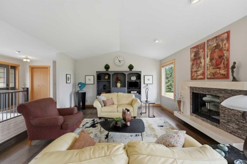 37 Wildrose Street, Rural Lacombe County, AB - Indoor Photo Showing Living Room With Fireplace