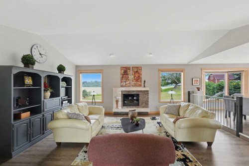 37 Wildrose Street, Rural Lacombe County, AB - Indoor Photo Showing Living Room With Fireplace