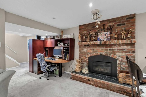 9111 Fairmount Drive Se, Calgary, AB - Indoor With Fireplace
