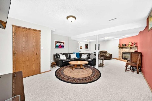 94 Hathaway Lane, Lacombe, AB - Indoor With Fireplace