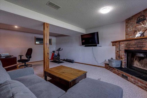 43 Oak Street, Red Deer, AB - Indoor With Fireplace