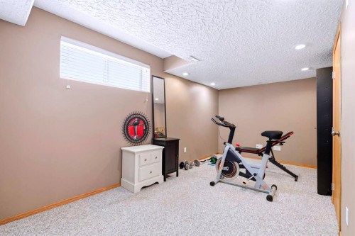 4518 54A Avenue Crescent, Innisfail, AB - Indoor Photo Showing Gym Room