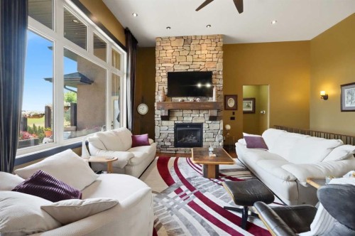 107A Wolf Run Drive, Rural Ponoka County, AB - Indoor Photo Showing Living Room With Fireplace