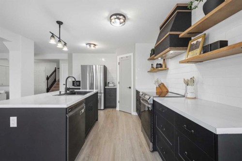 76 Lacey Close, Red Deer, AB - Indoor Photo Showing Kitchen With Double Sink With Upgraded Kitchen
