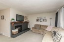 10 Valley Crescent, Lacombe, AB  - Indoor Photo Showing Living Room With Fireplace 