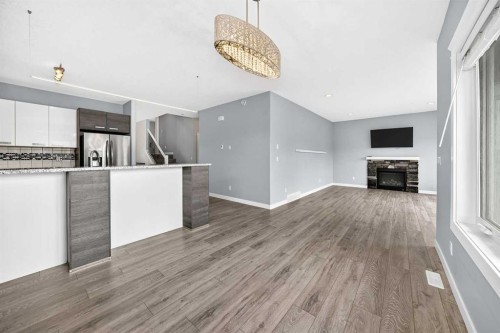 38 Cambridge Close, Blackfalds, AB - Indoor Photo Showing Kitchen With Fireplace