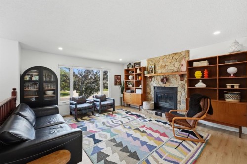 53 Reeves Crescent, Red Deer, AB - Indoor Photo Showing Living Room With Fireplace