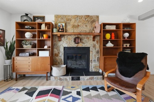 53 Reeves Crescent, Red Deer, AB - Indoor Photo Showing Living Room With Fireplace