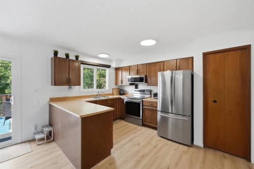 53 Reeves Crescent, Red Deer, AB - Indoor Photo Showing Kitchen With Double Sink