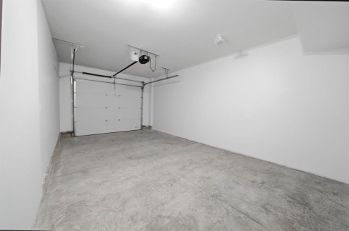 20 Toye Street, Red Deer, AB - Indoor Photo Showing Garage