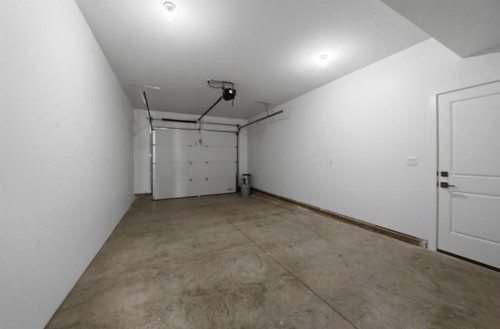 20 Toye Street, Red Deer, AB - Indoor Photo Showing Garage