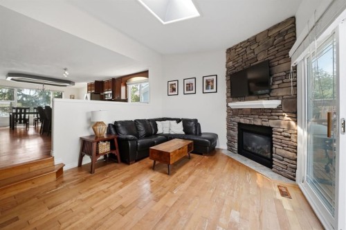 57 Page Avenue, Red Deer, AB - Indoor Photo Showing Living Room With Fireplace