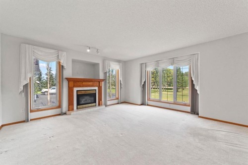 3806 50 Street, Camrose, AB - Indoor Photo Showing Living Room With Fireplace