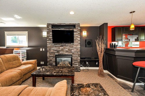 5206 33A Avenue, Camrose, AB - Indoor Photo Showing Living Room With Fireplace