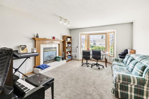 78 Duston Street, Red Deer, AB - Indoor Photo Showing Living Room With Fireplace