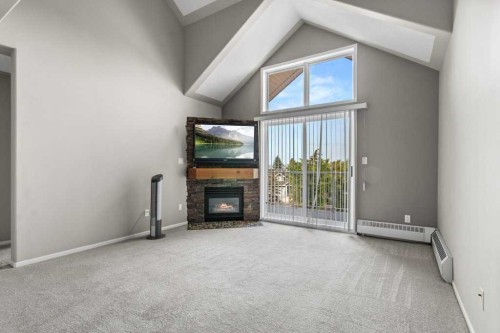 306-5435 Lakeshore Drive, Sylvan Lake, AB - Indoor With Fireplace